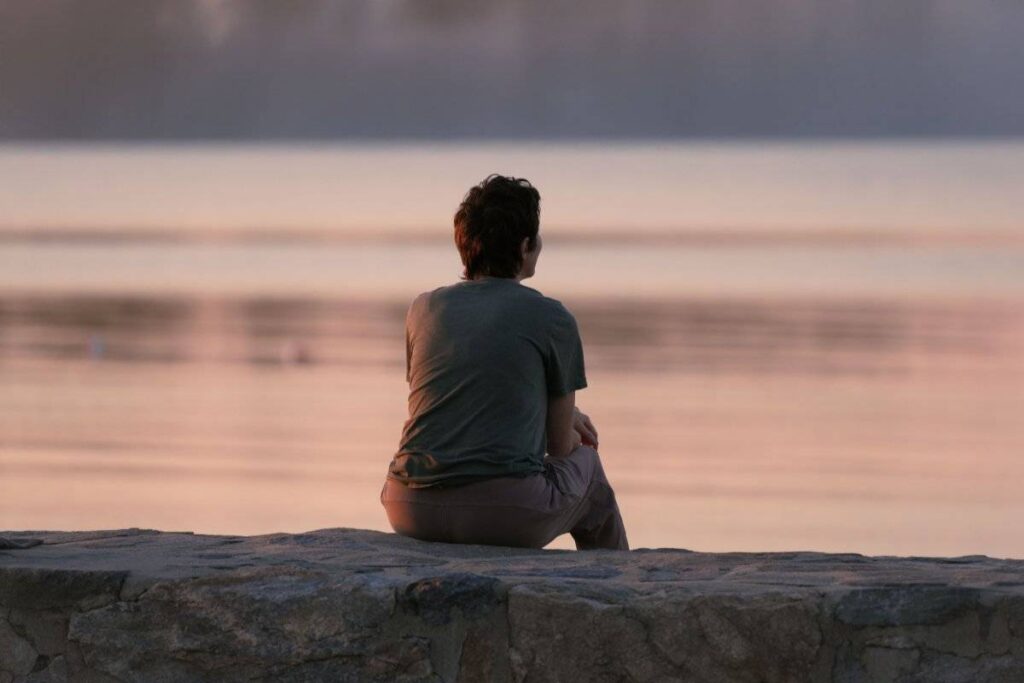 person reflecting on self doubt showing why it is hard to learn how to trust yourself