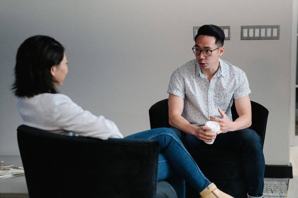 person listening calmly in conversation showing progress in learning how to trust yourself