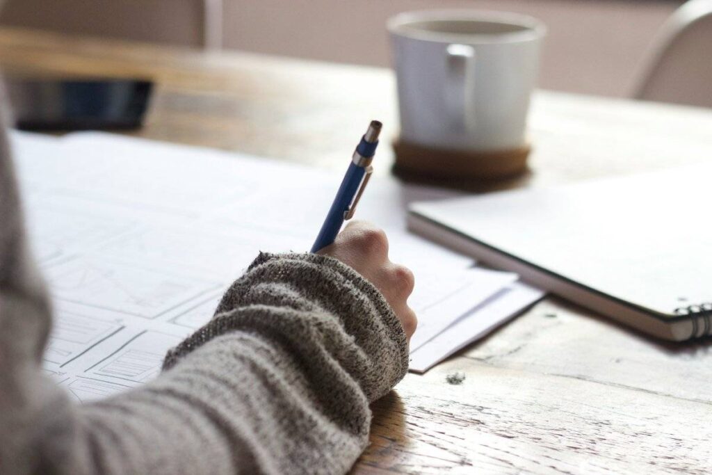 person breaking task into steps showing a key way of how to stop procrastinating