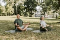 A person enjoying a balanced breakfast and doing light morning exercises in a bright environment, focusing on maintaining high energy levels throughout the day.