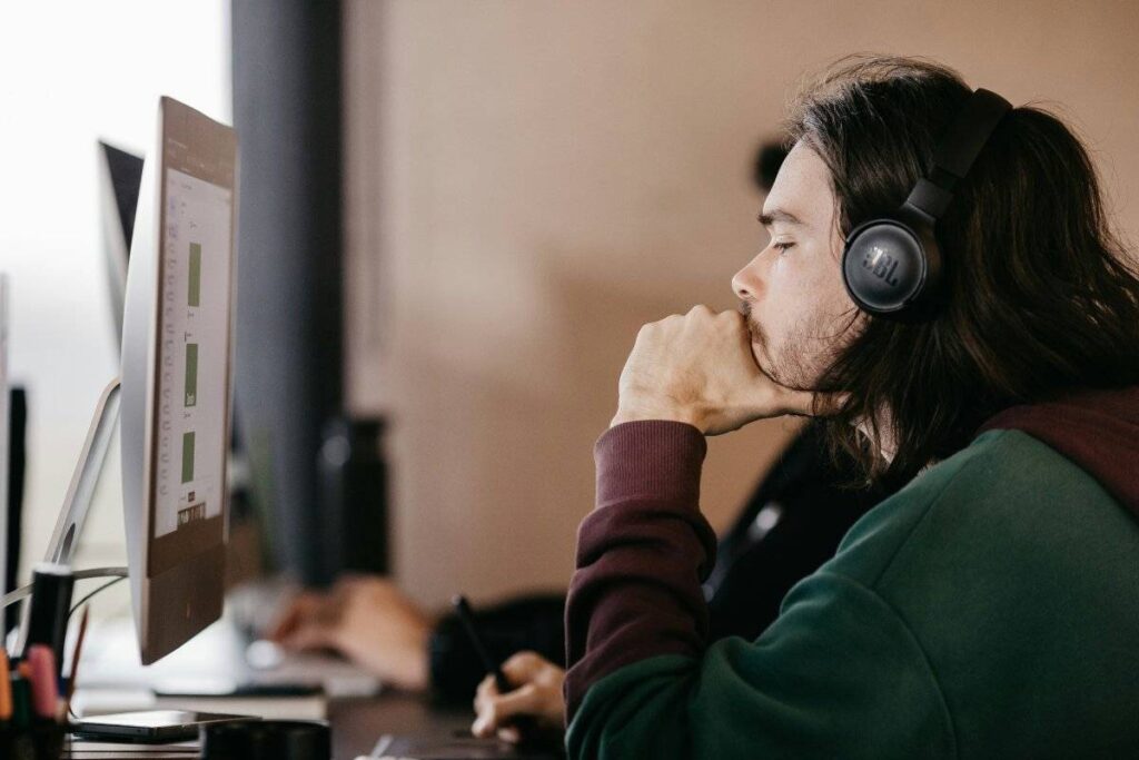 person fully engaged in work after learning how to stop procrastinating and finally start