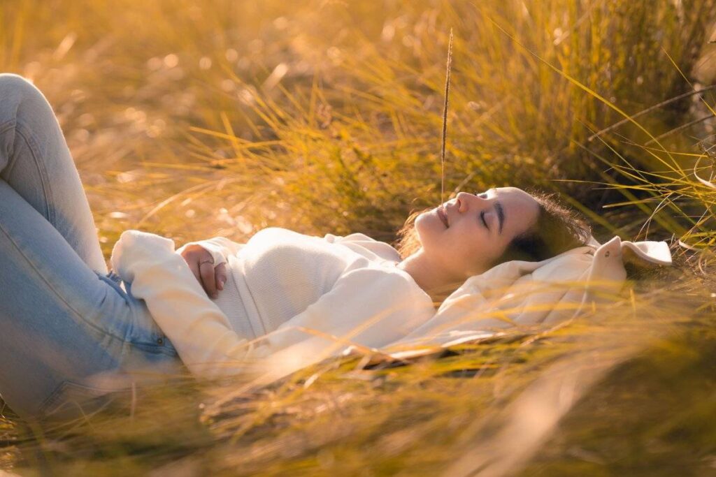 person resting peacefully showing the difference between rest and avoidance in how to stop being lazy