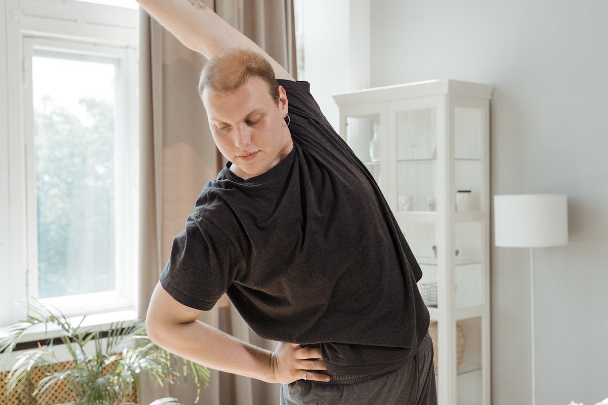 A Short Haired Woman Stretching Her Arm