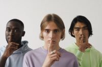person staying silent in conversation struggling to learn how to be more assertive