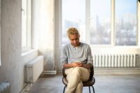 person waiting anxiously for approval struggling with how to stop seeking validation