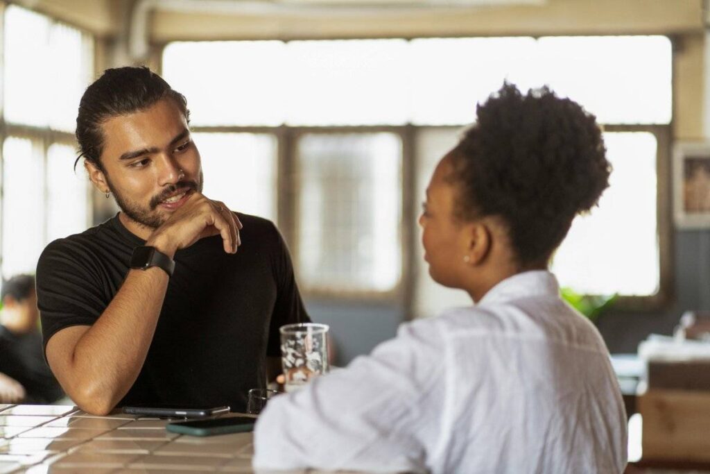 person listening confidently in conversation after learning how to stop seeking validation