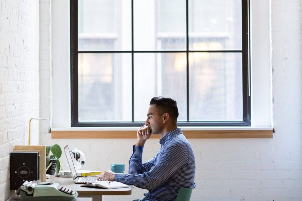 person working alone with focus and purpose after learning how to stop comparing yourself to others