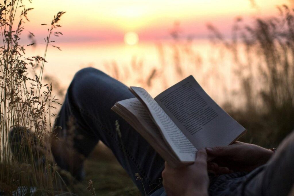 person sitting alone in nature peacefully learning how to deal with loneliness