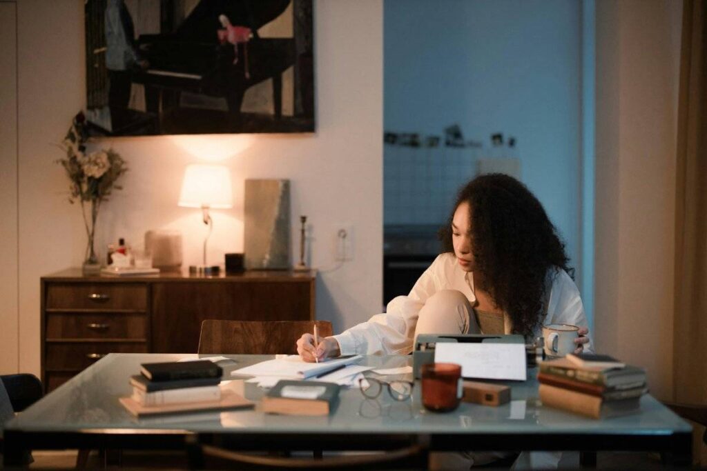 person writing compassionate letter to themselves as self compassion exercise