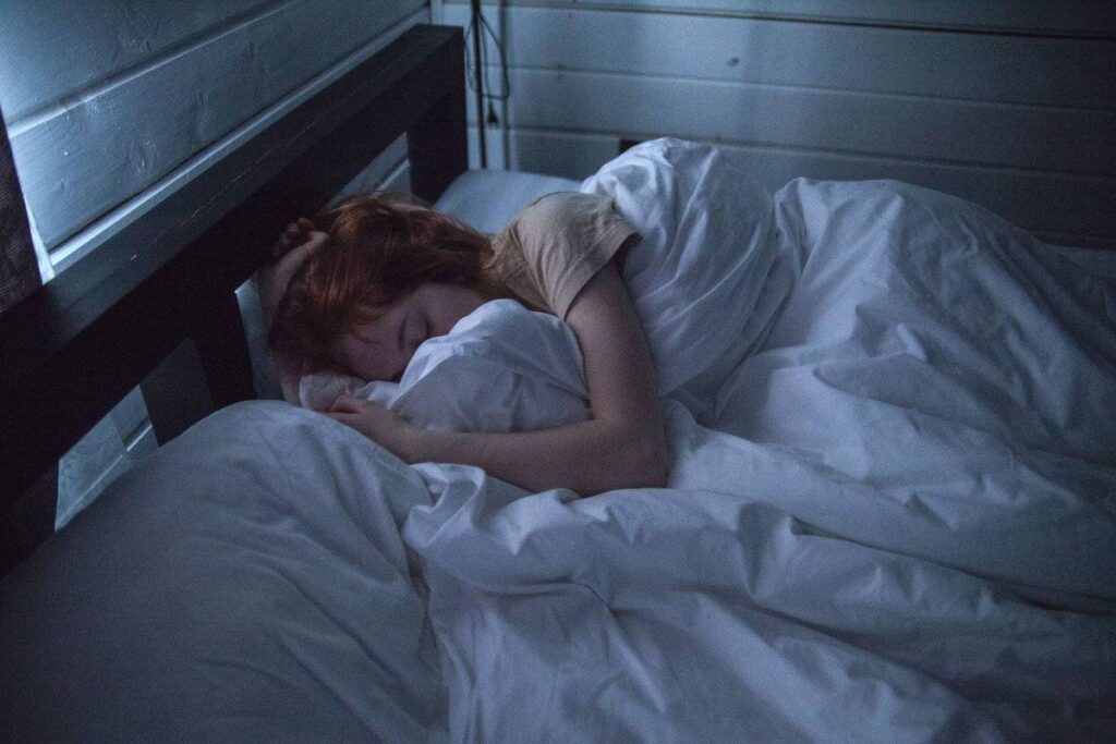 person sleeping peacefully after learning how to stop overthinking at night
