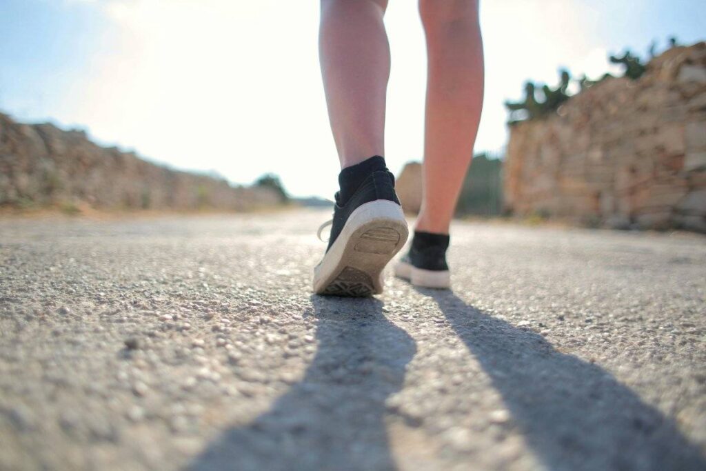 person walking forward with quiet determination after learning how to deal with rejection