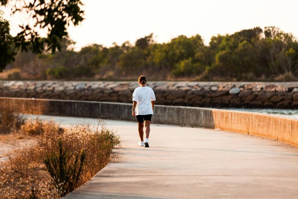 person walking confidently on their own path after learning how to stop comparing yourself to others
