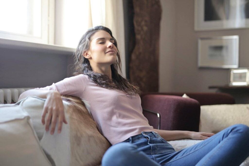 person feeling relieved after facing fear showing results of learning how to overcome fear