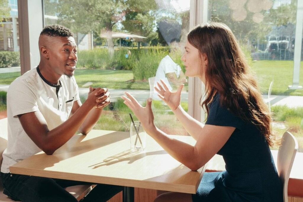 two people having honest conversation to rebuild trust in relationship