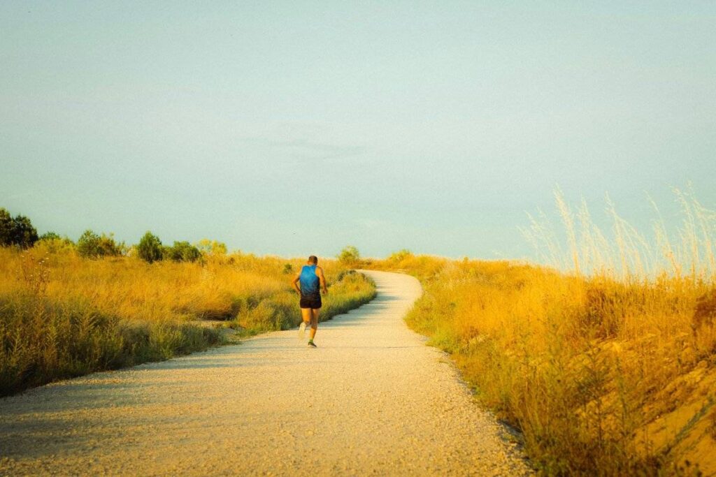 person walking alone at golden hour after learning how to deal with loneliness