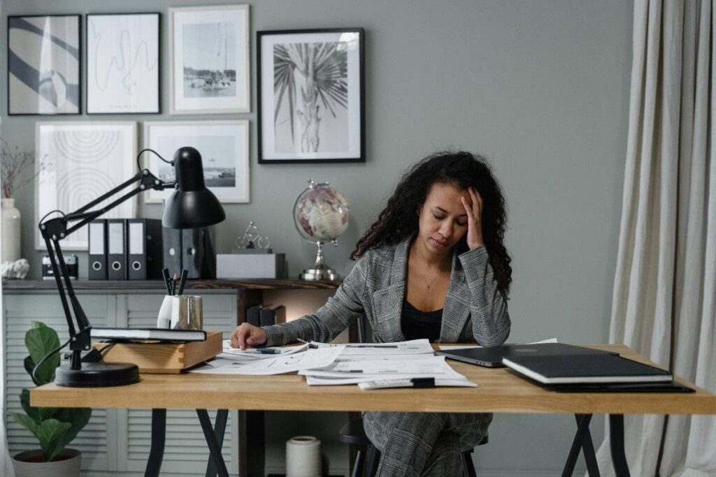 person working with deep focus at clean desk showing how to be more productive