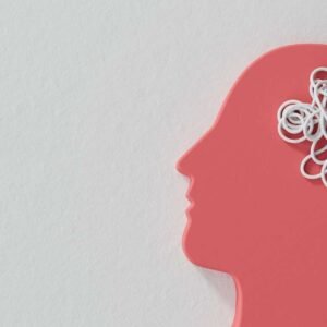 Silhouette of a red human head with tangled white lines inside, symbolizing mental health disorders and confusion on a light background.