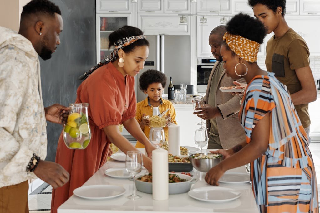 Family Setting the Table for Dinner