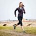 Woman running outdoors to increase energy levels and boost daily vitality naturally