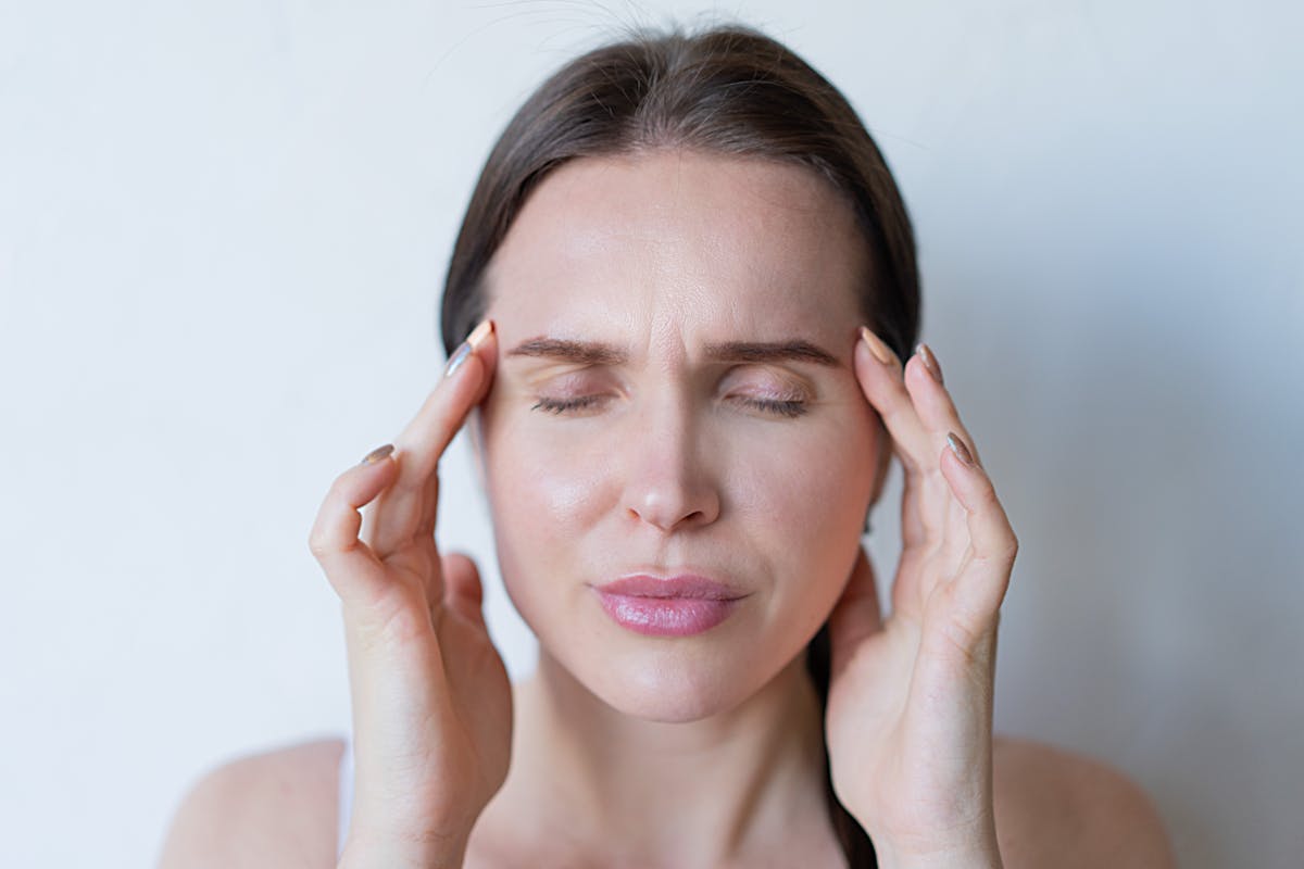 Woman Feeling a Strong Head Pain