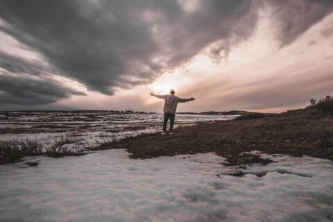 person standing steady through difficulty showing the honest reality of how to build resilience