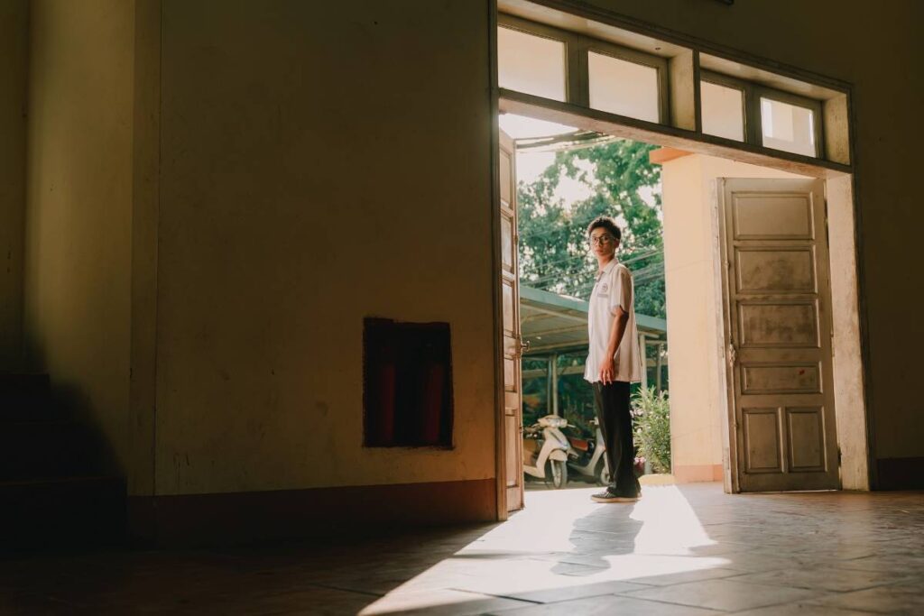 person stepping forward despite hesitation showing courage needed in how to grow as a person