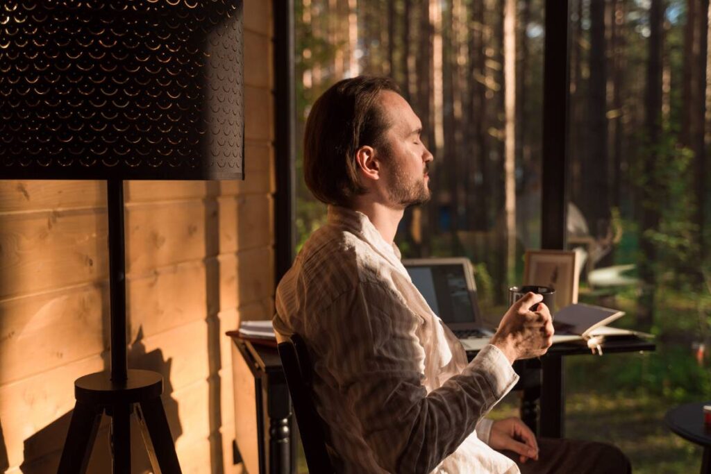 person sitting calm and settled showing the earned peace that comes from learning how to deal with stress