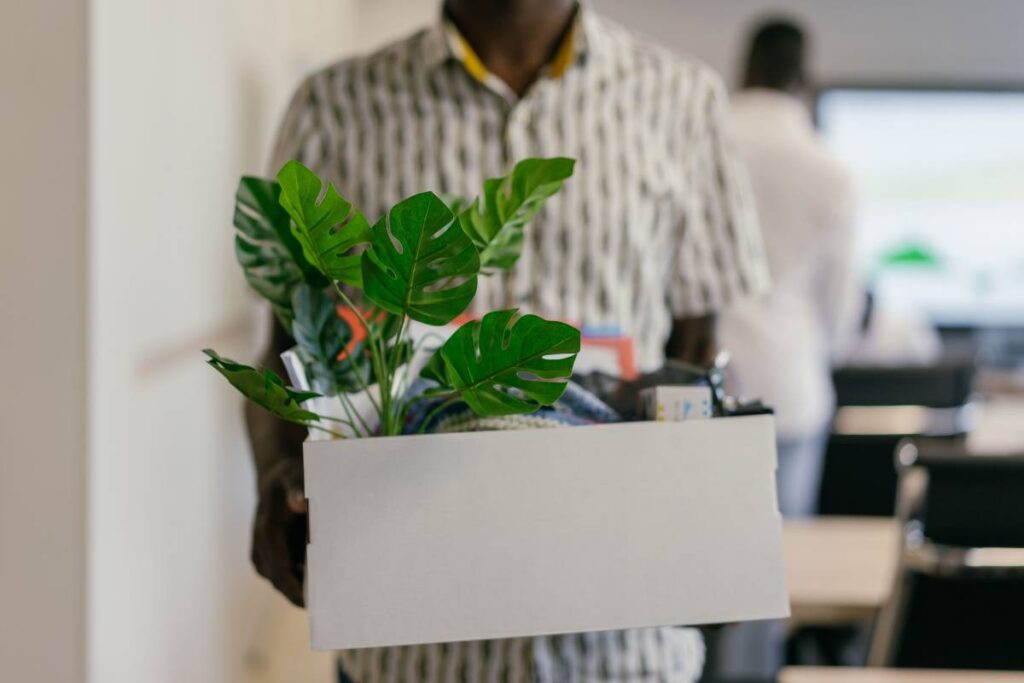 person leaving office calmly showing the separation of work stress after learning how to deal with a difficult coworker