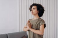 person pausing mid-action showing the crucial moment of awareness needed to learn how to break a bad habit