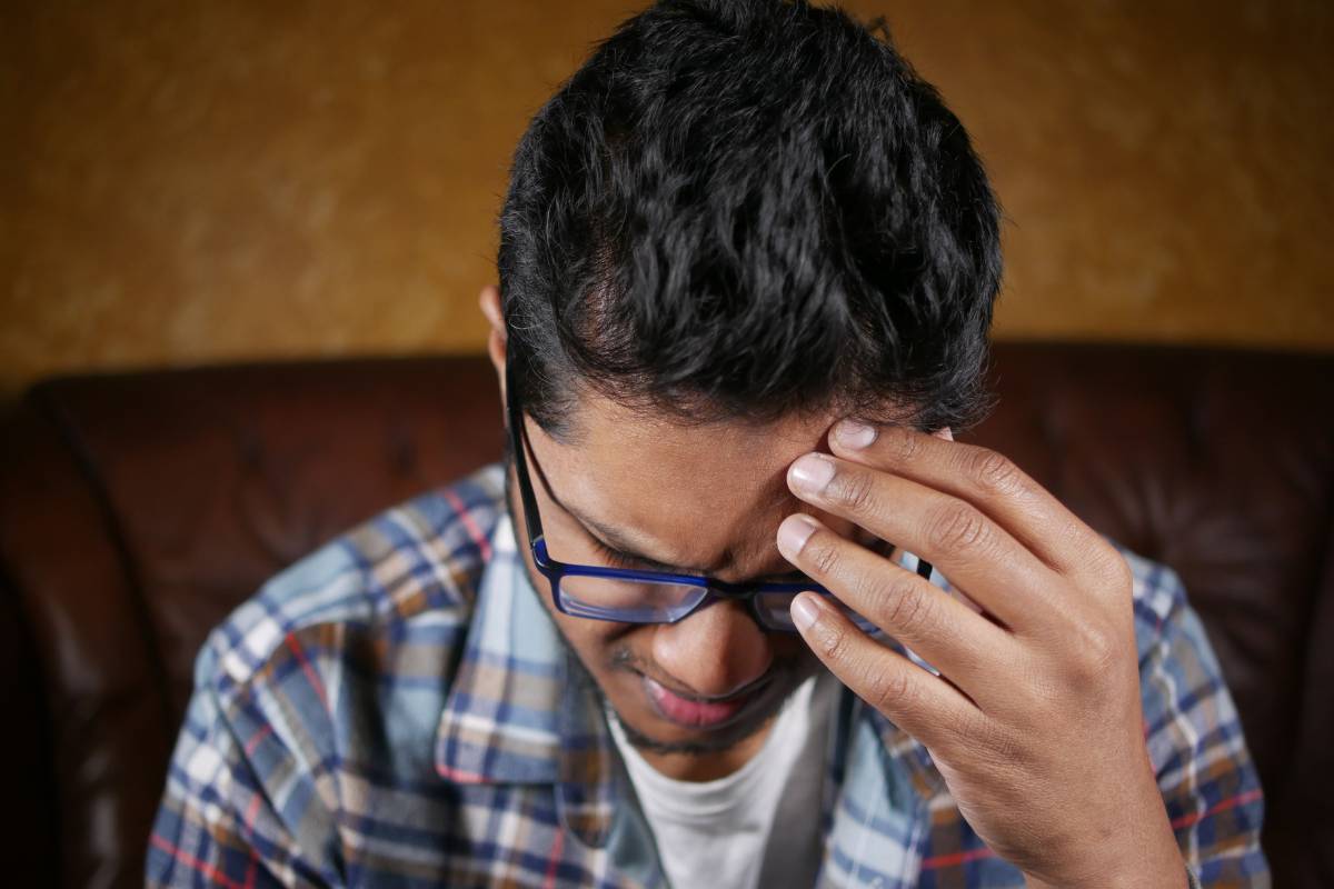 person with tense expression showing the honest weight of anger before learning how to deal with anger