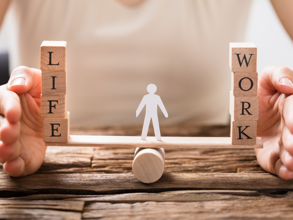 Work-life balance concept with wooden blocks showing life and work, symbolizing better mental health and productivity