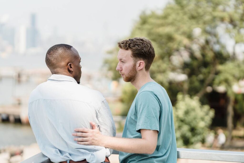 two people in calm direct conversation showing constructive expression in how to deal with anger