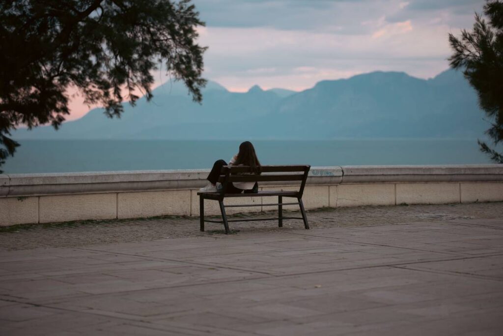 person sitting alone allowing emotions showing the practice of processing in how to be less sensitive