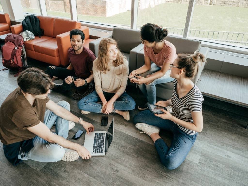 Group of young people practicing communication techniques in a casual setting
