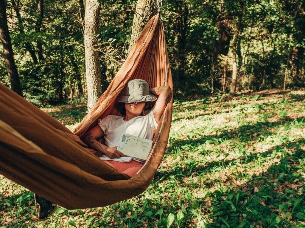 Relaxing in a hammock in the forest for mental clarity and stress reduction