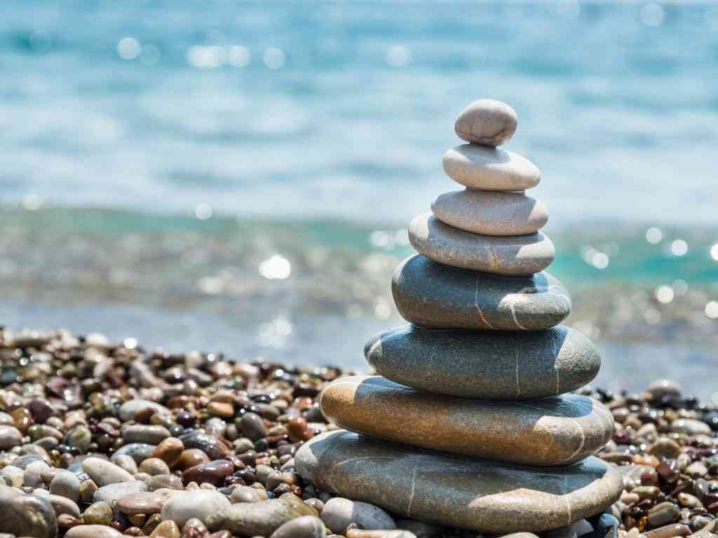 Stacked stones by the sea symbolizing balance and mindfulness Relaxation techniques for anxiety