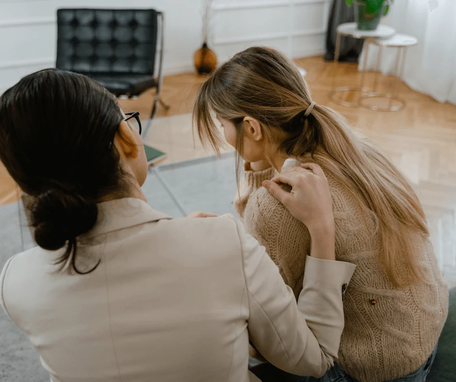 Therapist comforting a woman dealing with anxiety- how to deal with anxiety in real life