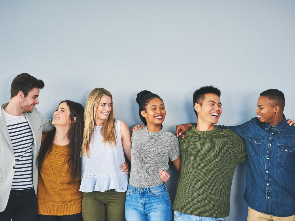 Group of friends laughing together – healthy emotional relationships boosting mental health