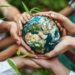 Hands holding Earth together symbolizing global mental health resources and community support