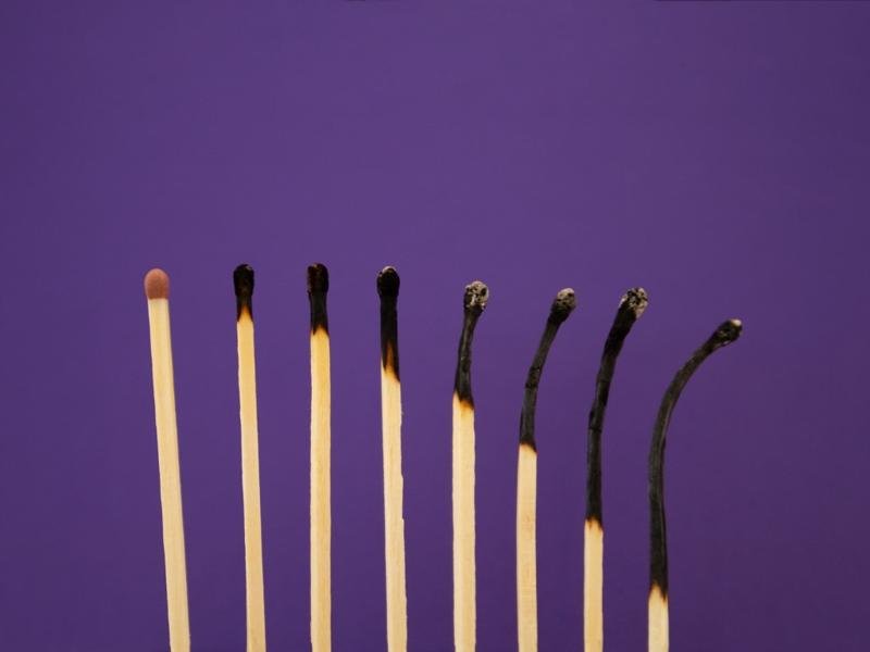 Burnout recovery concept with burnt matches symbolizing emotional exhaustion and recovery process
