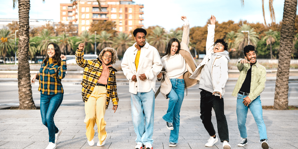 A group of Gen Z young people standing together outdoors, expressing unity and solidarity.