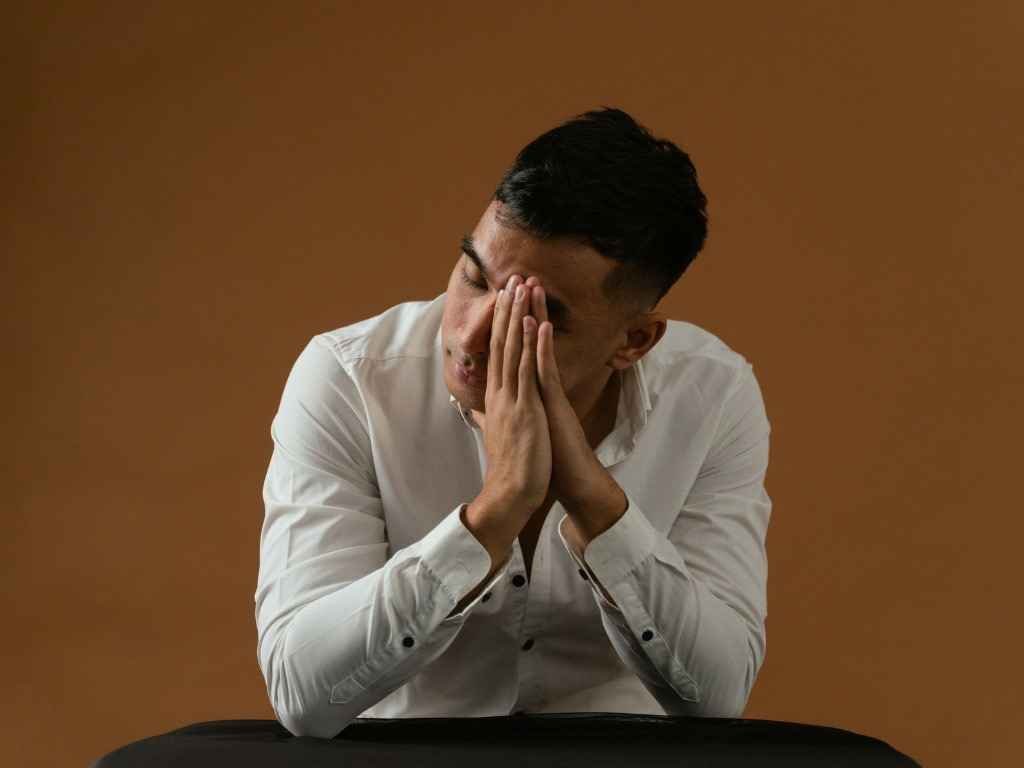 Man experiencing emotional numbness and mental exhaustion