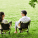 Couple communication skills – man and woman talking calmly in a park, building emotional connection and healthy relationship.