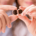 Couple holding wedding rings together symbolizing unity, love, and a healthy marriage that lasts.