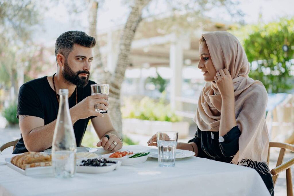 person tense at dinner table showing the eggshell walking described in signs of an unhealthy relationship