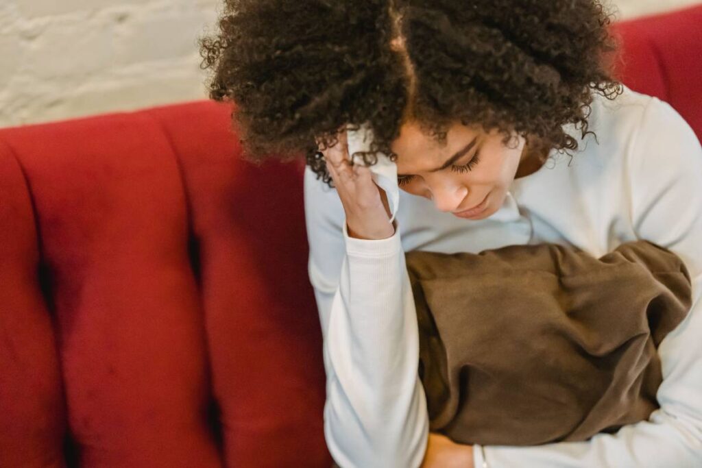 person sitting exhausted and drained showing the real cost of not knowing how to set boundaries