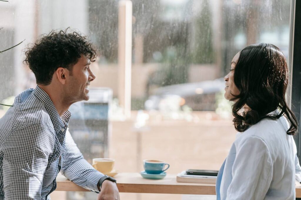 two people in calm direct conversation showing boundary language in practice when learning how to set boundaries