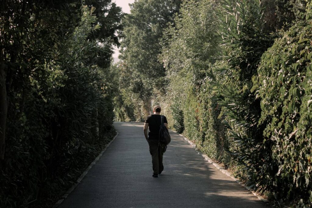 person walking forward calmly showing recovery after recognizing signs of an unhealthy relationship