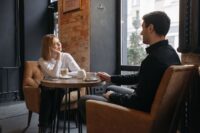 two people in serious honest conversation showing the beginning of learning how to fix a relationship