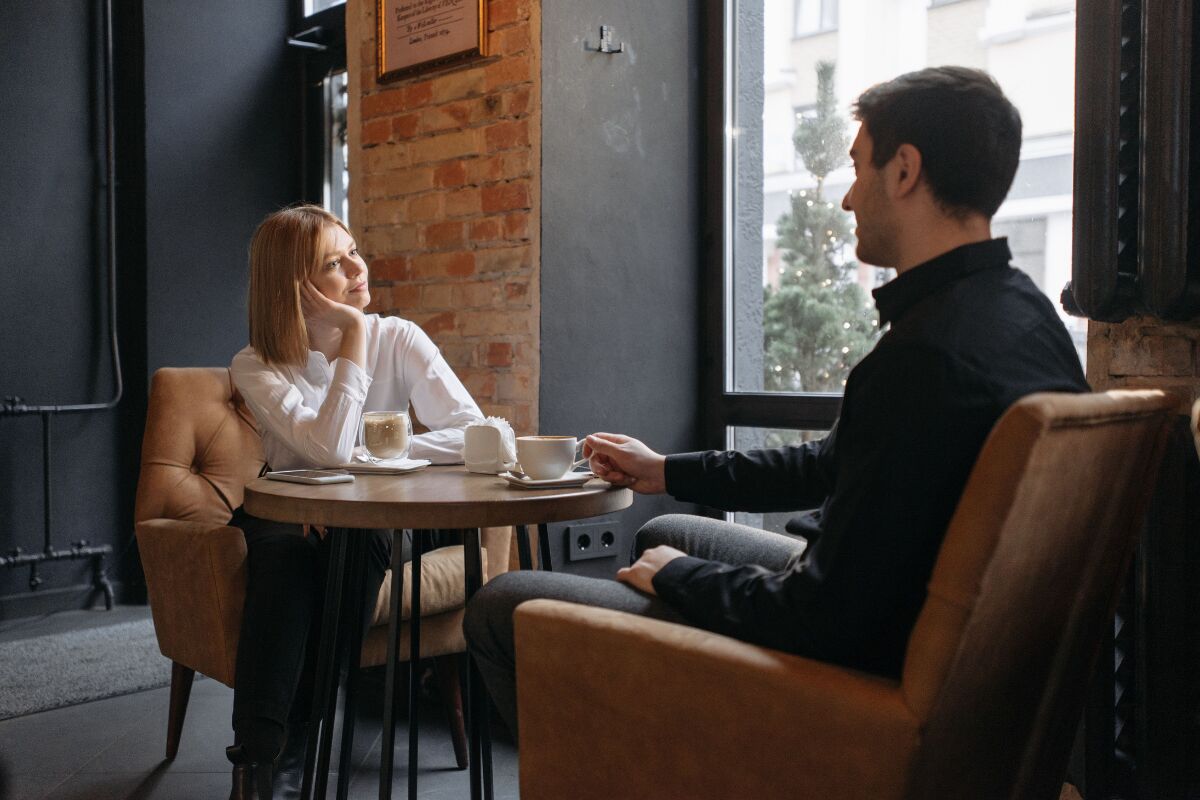 two people in serious honest conversation showing the beginning of learning how to fix a relationship